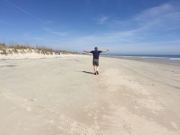 Bill is showing how flat and wide this beach is! Great for long walks.