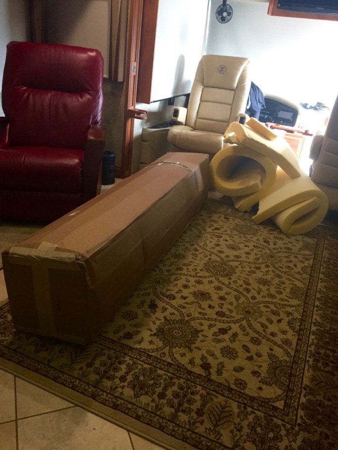 Our old mattress ripped up easily, laying beside the new mattress in a box!